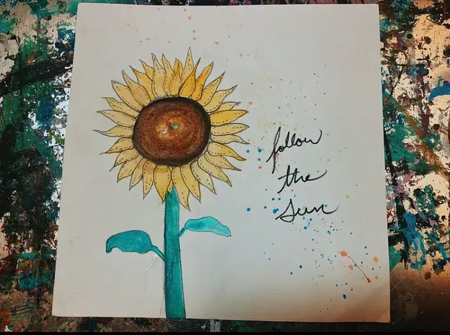 a sunflower watercolor painting by Spencer Cooley